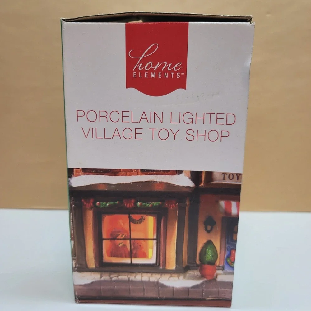 Home Elements Christmas Porcelain Lighted Village Toy Shop w/Window Scene Decor